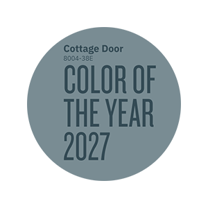 Circular graphic featuring the Valspar Color of the Year 2027 designation in Cottage Door blue-gray tones.