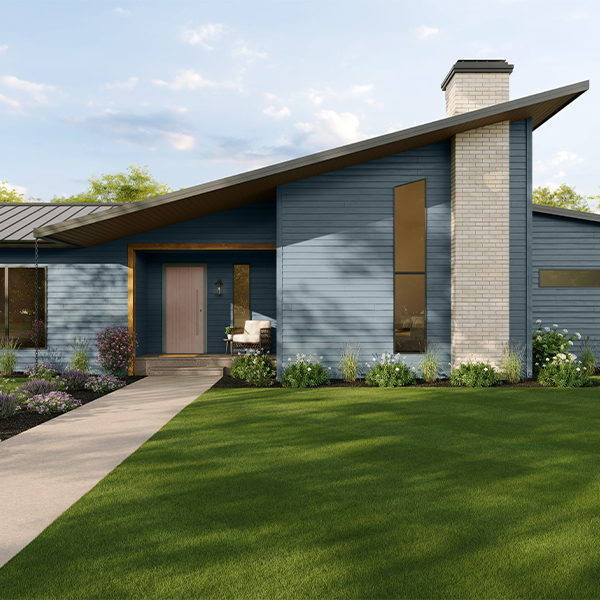 Contemporary single-story home with dark trim and natural materials accented by Cottage Door blue-gray siding, surrounded by manicured landscaping.