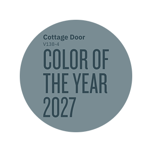 Circular graphic featuring the Valspar Color of the Year 2027 designation in Cottage Door blue-gray tones.