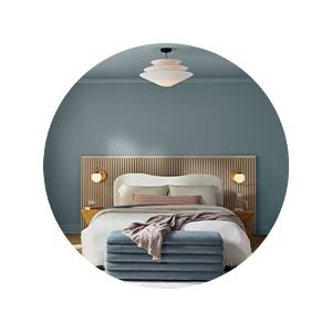 Cozy bedroom painted in Cottage Door blue-gray hues, demonstrating how the color creates a calming and sophisticated residential space.