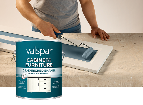 Valspar Cabinet & Furniture Oil-Enriched Enamel container shown during cabinet painting, illustrating a smooth, durable furniture finish.