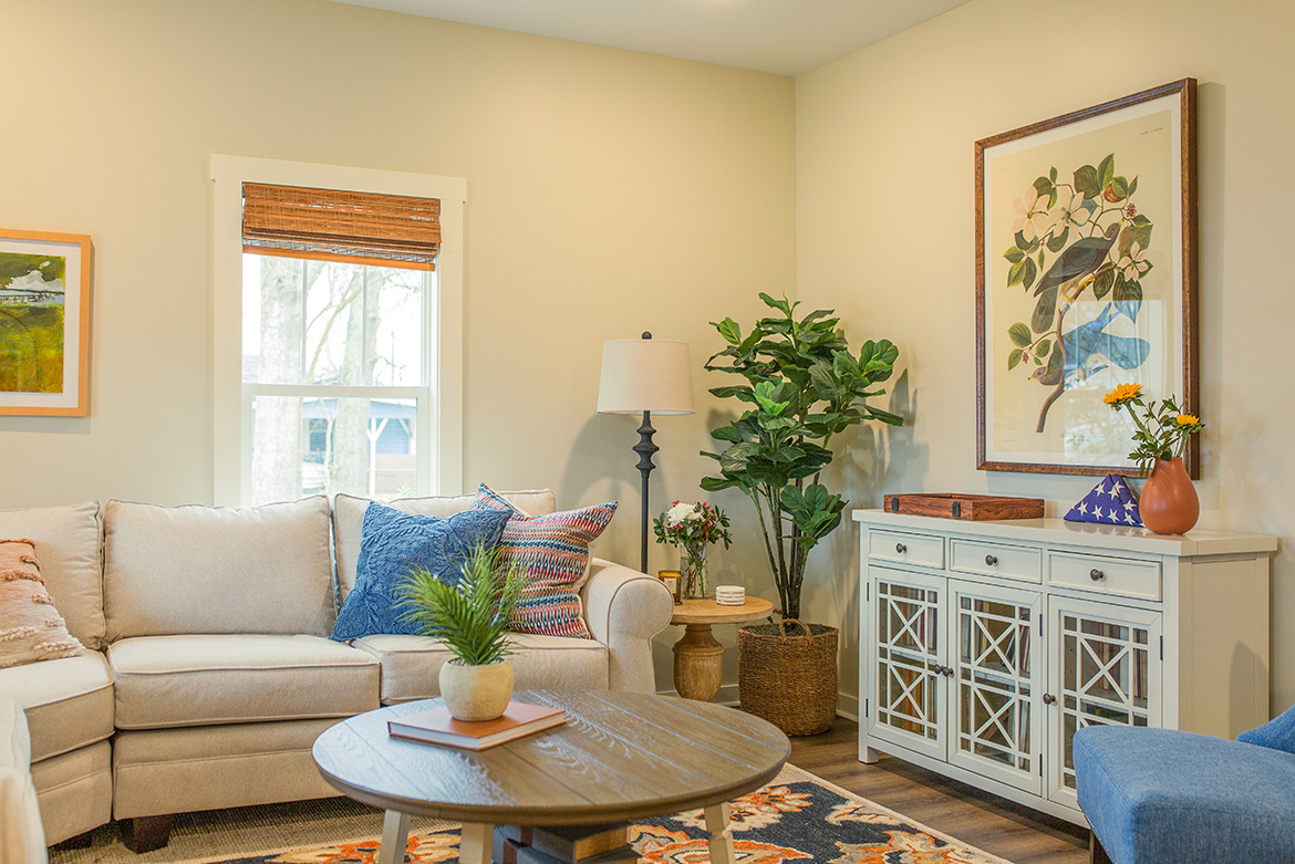 As seen on HGTV’s Hometown Season 7, Ben and Erin used Valspar’s "Shoreline Haze" paint in a eggshell finish for the living room walls of the Hollingsworth Home. Paint Code: 6008-1B. On the trim and ceiling, Valspar's Statuesque was used in semi-gloss and flat finishes. Paint Code: 7002-5.