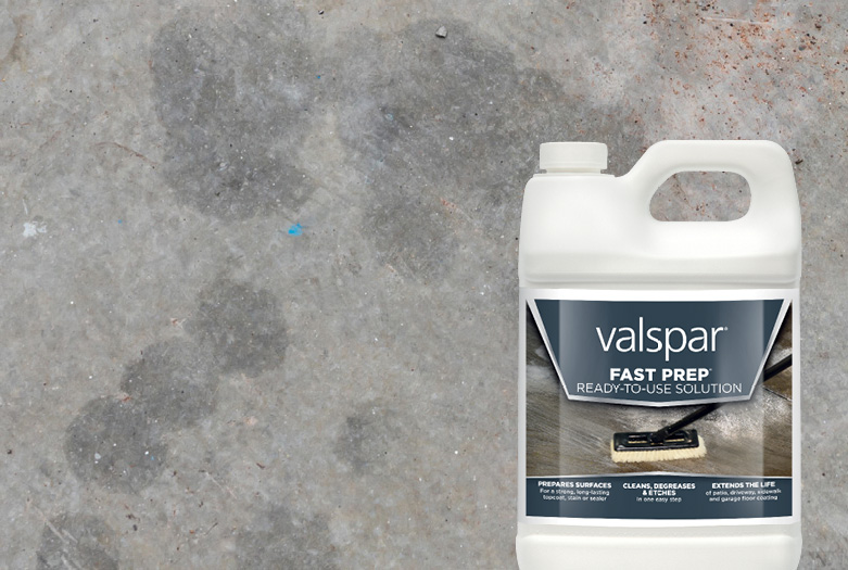 Container of Valspar Fast Prep in foreground against a concrete background.