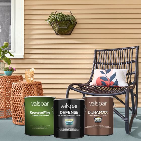 A porch with a chair and tables, plus cans of Valspar Cabinet, Door & Trim, Medallion Plus & Pro-Hide Gold Ultra cans.