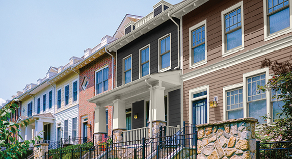 Older rowhomes in complementary color schemes featuring Free Wheeling, Noir and Polar White.