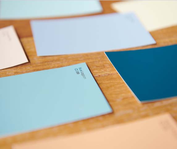 multiple color cards laid out to choose a paint color
