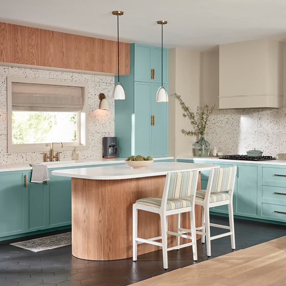 Modern kitchen pairs natural wood with peaceful clue cabinetry. 